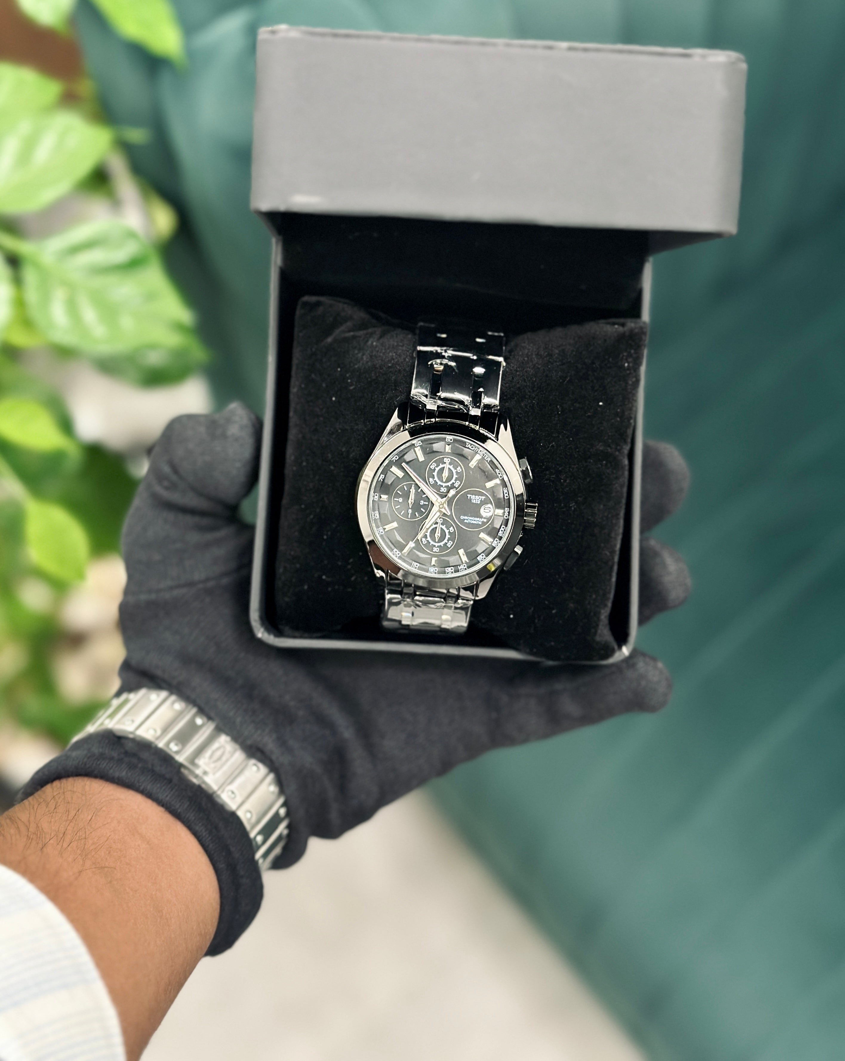 Couturier stainless steel chronograph watch.