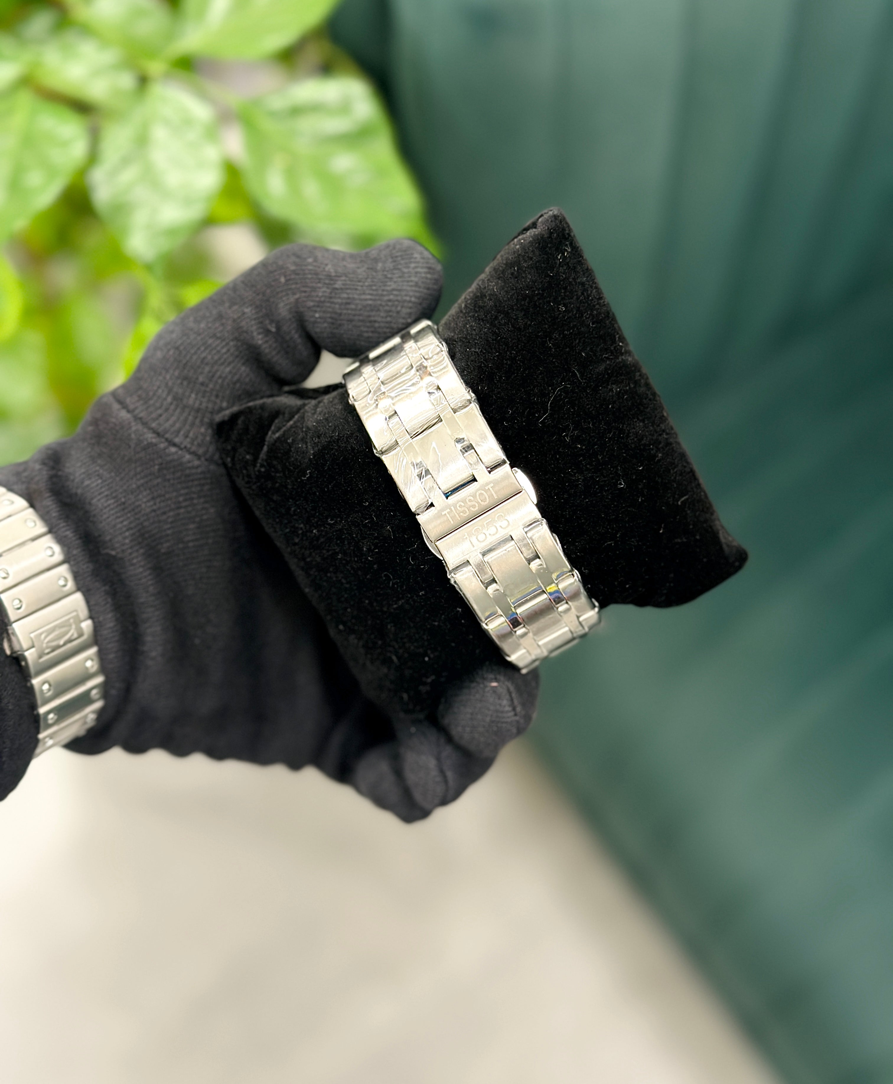 Couturier stainless steel chronograph watch.