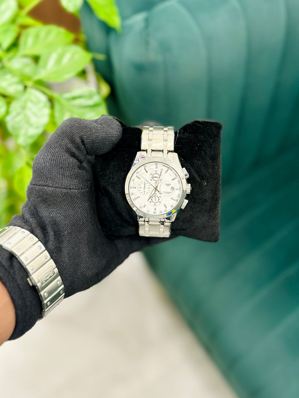 Couturier stainless steel chronograph watch.